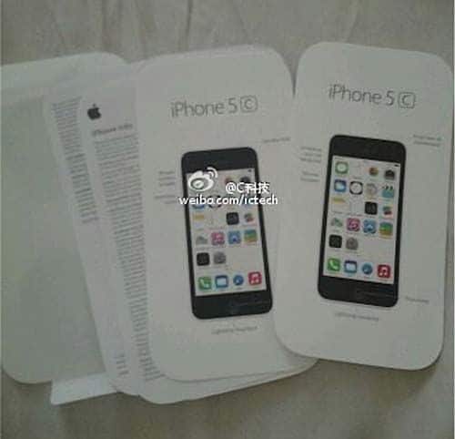 Manual de instrucciones del iPhone 5C junto a las tarjetas de garantía